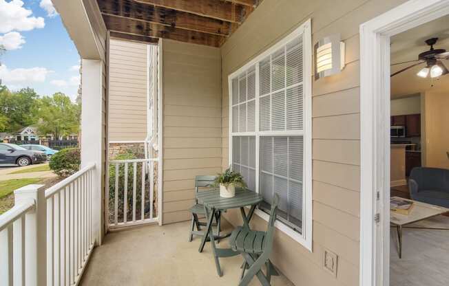 a patio with a table and chairs on it