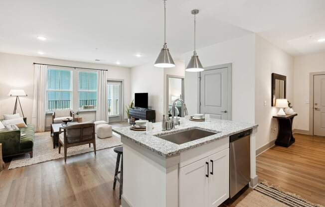 an open kitchen and living room with a counter top