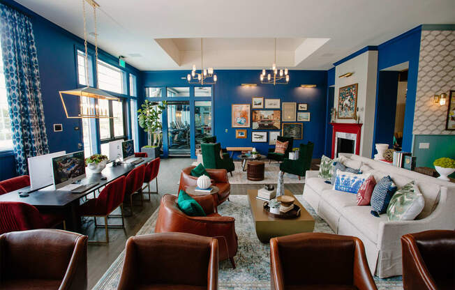a living room with blue walls and a white couch