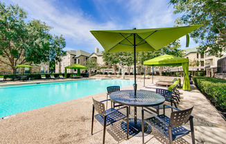 View of Pool Area, Showing Picnic Areas, Cabanas, and Loungers at Stonebriar of Frisco Apartments