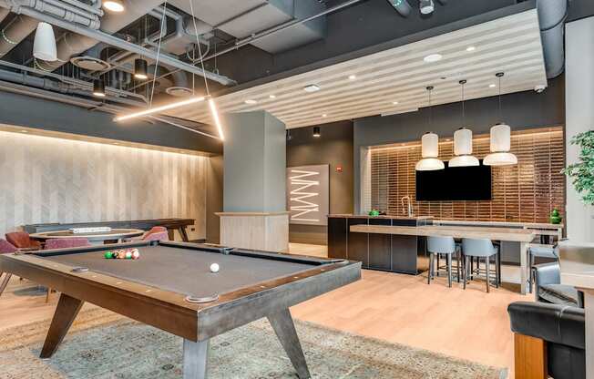 a game room with a pool table and a bar  at Cassidy on Canal, Chicago, Illinois