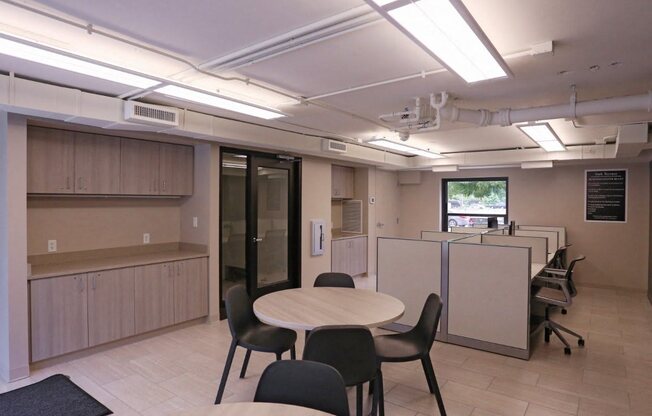 Resident Business Center with tables, seating, and window