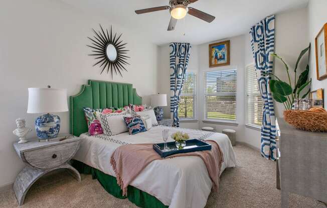 Radiate Apartments in San Marcos, TX with wall to wall carpet, stylish decor, white walls and bay windows