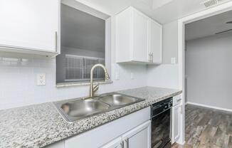 a kitchen with a stove and a sink