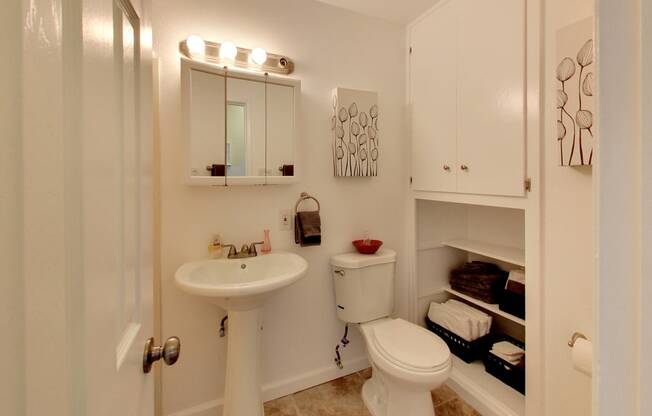 The Post Apartments bathroom with vanity and storageat THE POST Apartments, California, 94523