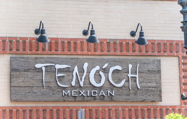 a sign on the side of a building "Tenoch Mexican"