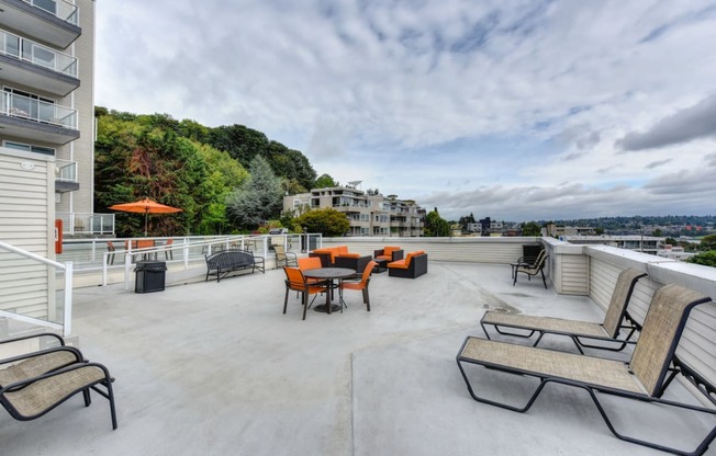 Rooftop Lounge with Lounge Chairs, Orange Chairs and Trees