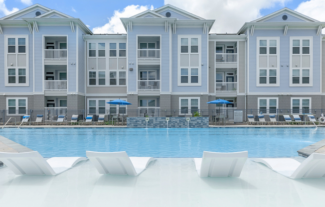 a large pool of water in front of a building