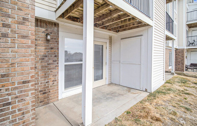 a private patio with enclosed storage at Black Sand Apartment Homes in Lincoln, NE