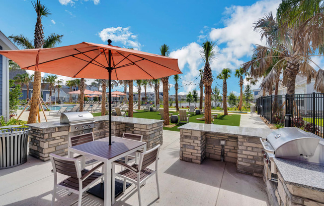 a patio with a table and chairs and a hot tub  at The Sophia, Florida, 34275