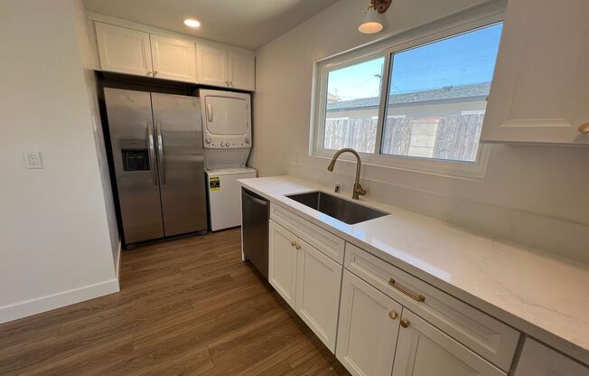 **Newly Renovated 2BDRM/1BTH with in unit laundry, private backyard and two parking spots!!**