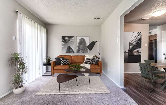 an open living room with a couch and a coffee table  at Shadow Ridge, Arlington, 76013