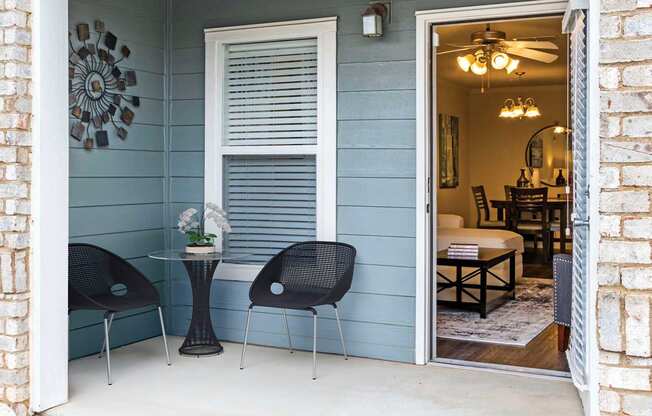 Private patio with seating at Carolina Point Apartments, Greenville, SC, 29607