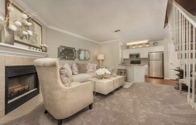 a living room with a fireplace and a couch at Highland Ridge Apartments, Overland Park , KS 66210