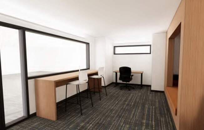 A room with a desk and chairs with a window.