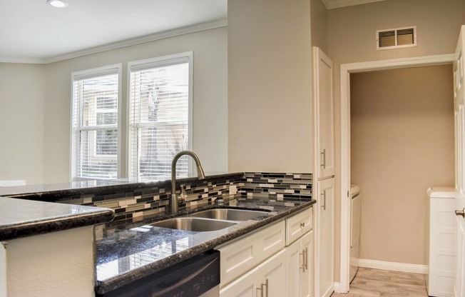 kitchen countertop and sink overlooking the patio door