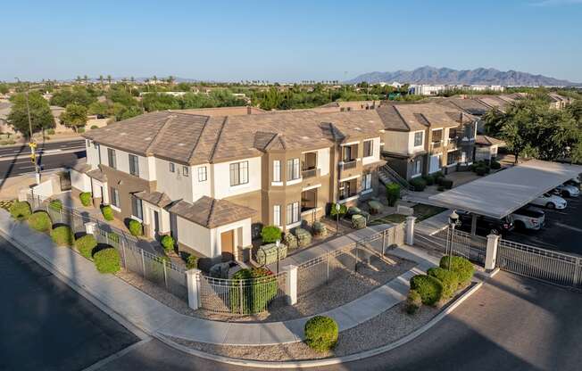 A row of houses with a mountain in the background.