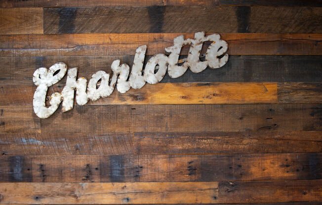 a sign that reads chocolate on a wooden table