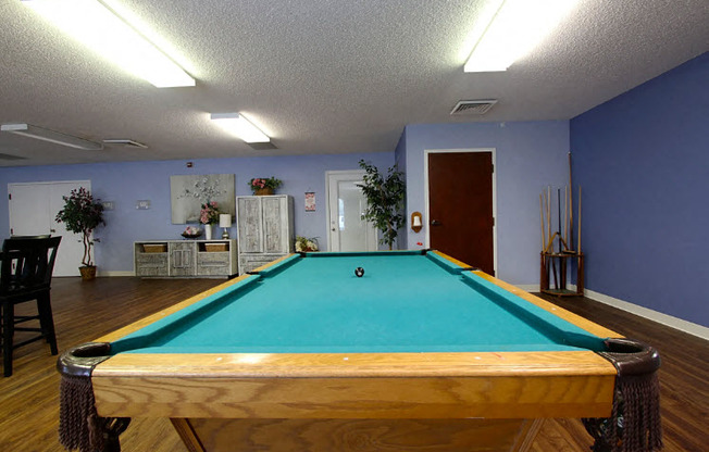 a pool table in the center of a room