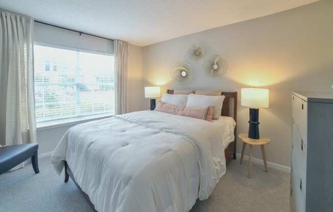 a bedroom with a bed and a large window at Twenty35 at Timothy Woods, Athens, Georgia