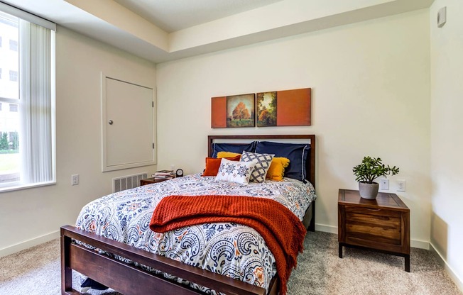 Bedroom With Large Window at The Legends at Berry 62+ Apartments, St. Paul, MN