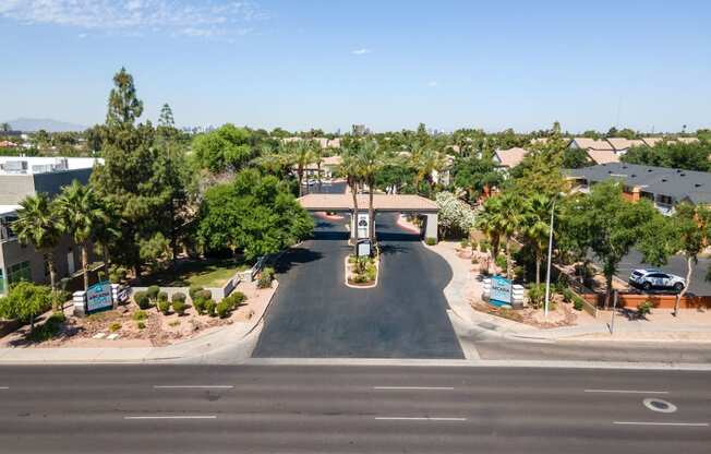 an aerial view of a neighborhood with a street and houses