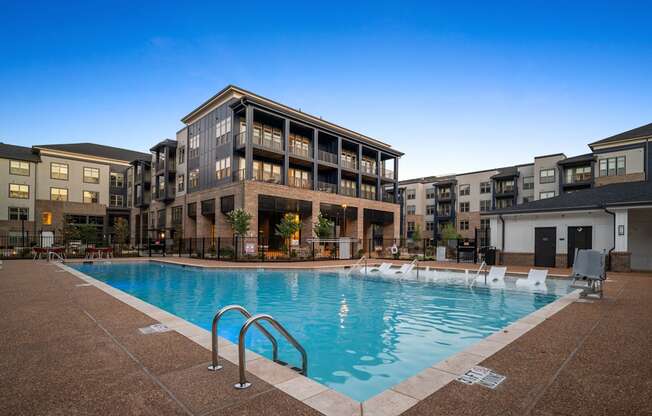 a swimming pool in front of an apartment building at Preston Ridge, Cary, NC, 27513