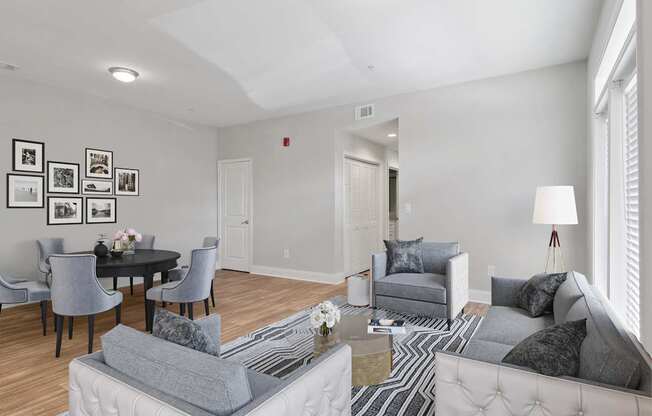 Living room with neutral finishes and updated flooring at Mirador at Peachtree Apartments.