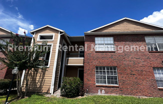 3/2 Regency Gardens 1st Floor Condo with New Plank Fooring, Stainless Appliances, and Fresh Paint!