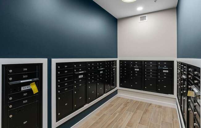 A row of black lockers with numbers on them.