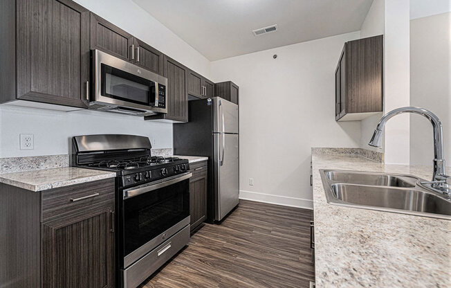 a kitchen with stainless steel appliances at Trade Winds Apartment Homes, Elkhorn, NE