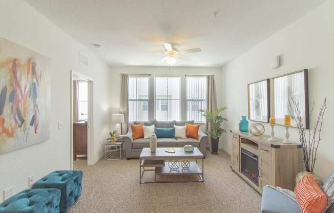 a living room with a couch coffee table and fireplace