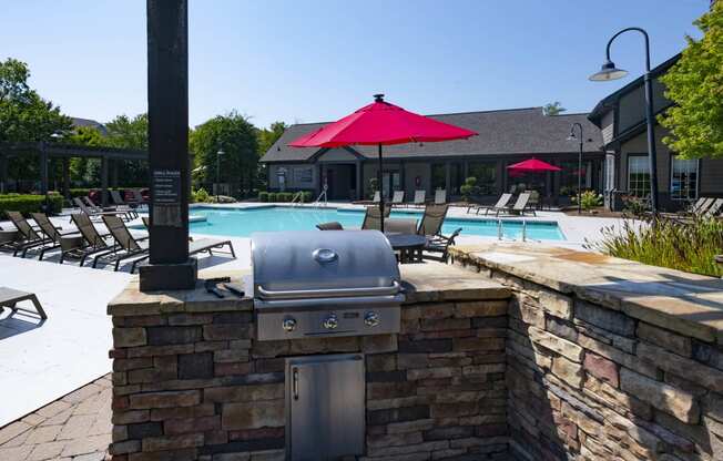 our apartments have a pool and an outdoor bar with a grill