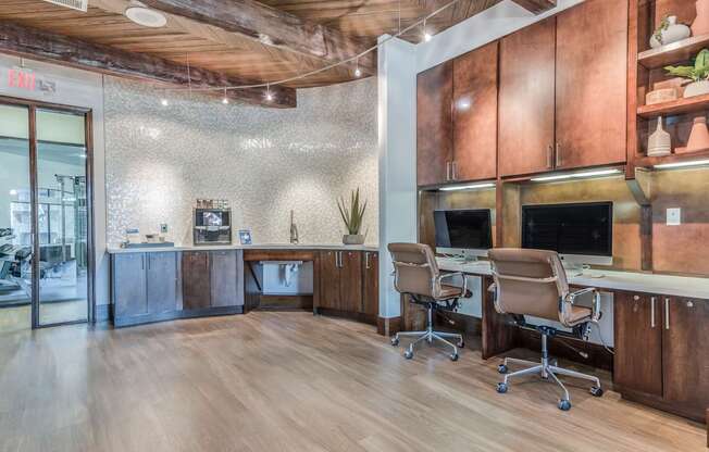 A wood and tile office space with a desk and chairs.