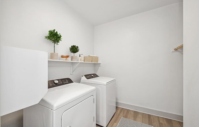 Model Laundry Room with Washer & Dryer at Alta 3Eighty Apartments located in Aubrey, TX.
