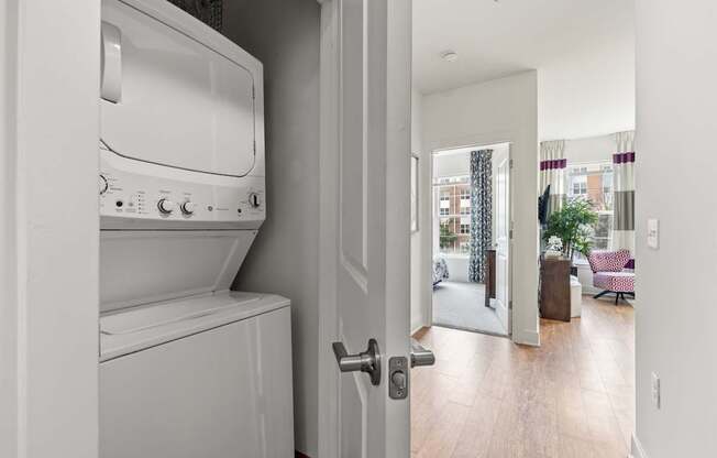 A white washing machine and dryer in a laundry room.
