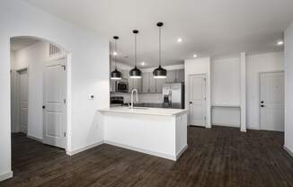 a kitchen with white walls and a white counter top