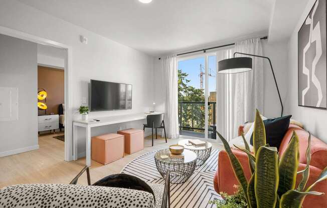 A living room with a red couch and a television.