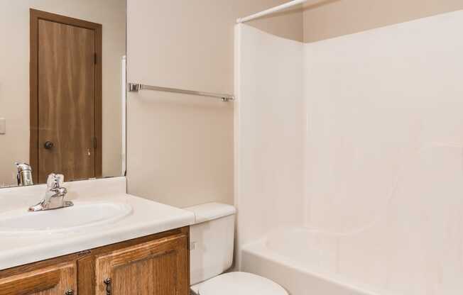 Grand Forks, ND Richfield Apartments. A bathroom with toilet sink and tub