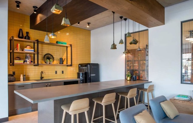 the kitchen and dining area of a modern house