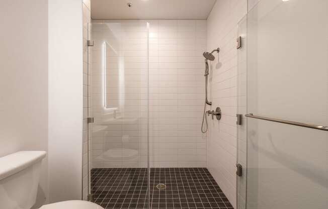 Bathroom with walk-in shower in a 1400 FIG Live and Work Apartment at 1400 S. Figueroa St., Los Angeles, CA 90015.