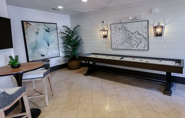 Resident lounge with shuffleboard  area at Two Addison Place Apartments , Pooler, 31322