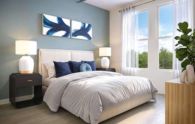 A bedroom with a bed, two lamps, and a painting on the wall.