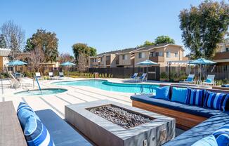 blue couch by the outdoor fire pit