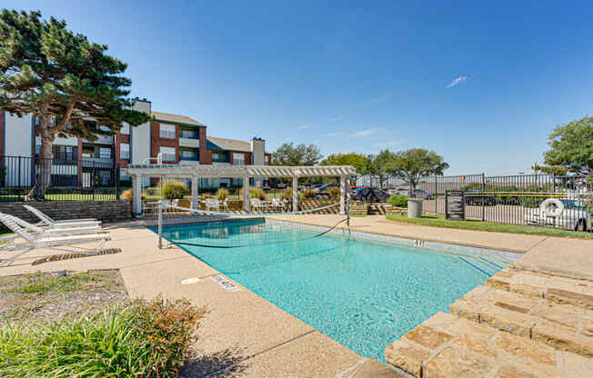 our apartments offer a swimming pool with a gazebo and chairs