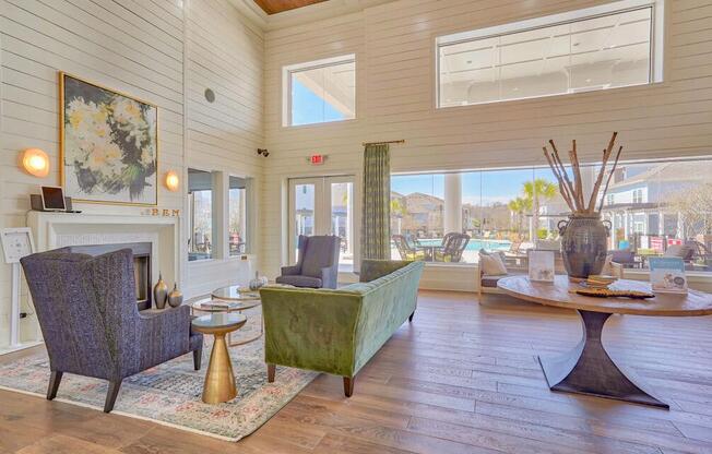 a living room with a fireplace and a large window at Cypress River, Ladson, 29456