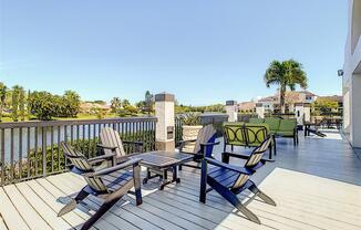 Apartments In Coconut Creek for Rent – Waterview at Coconut Creek – sun deck overviewing lake with seating area