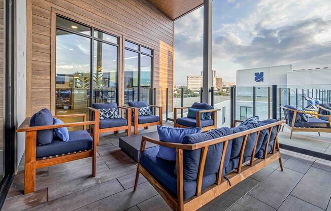 a living room with a balcony and a view of the city