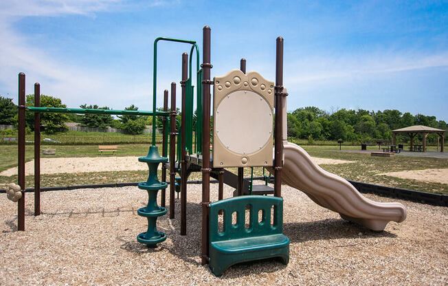 Community Playground with Swing Set at Pickwick Farms Apartments in Indiana 46260