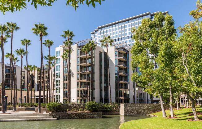 Exterior facade framed by palms and vibrant landscaping.